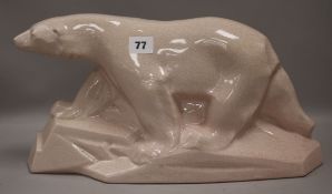 A pink glazed crackleware Deco polar bear height 21cm width 39cm