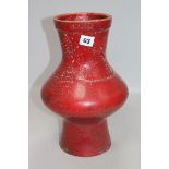 An Oriental red glazed pottery vase height 34cm