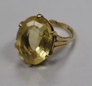 A 9ct gold and oval citrine dress ring, size L.