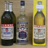 Three bottles of Pernod and one of Vodka