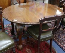A 1930's Chippendale style mahogany extending dining table, with one spare leaf W.135cm without