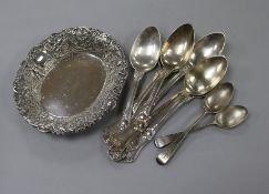 A set of six French silver dessert spoons, a silver repousse dish and two silver teaspoons.