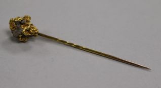 A yellow metal 'nugget' stick pin (tests as 22ct gold), 7.3g