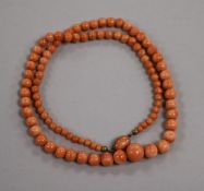 A single strand graduated coral bead necklace, with white metal clasp, gross weight 32 grams, 51cm.