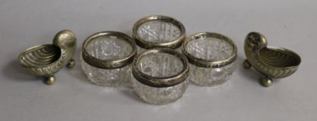 A set of 4 silver mounted glass salts and a pair of plated shell salts.