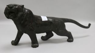 A bronze tiger height 19.5cm length 43cm