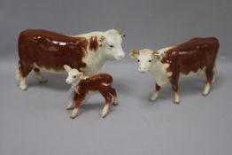 A Beswick early Hereford cattle family comprising bull 949, cow 948 and calf 901B, roan gloss