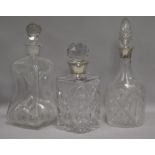 Two silver mounted decanters and a Dutch decanter tallest 30cm