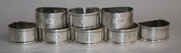 A set of six 1940's silver napkin rings and a pair of engine turned napkin rings.