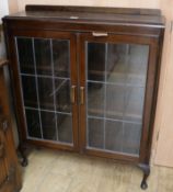 An oak two door leaded glazed bookcase W.92cm