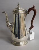 A 1970's Georgian design silver coffee pot, C.J Vander Ltd, London, 1973, 25.5cm, gross 29.5 oz.