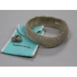 A Tiffany & Co sterling silver mesh link bracelet, a Pair of similar knot ear studs and a