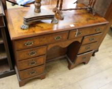 A George III style walnut kneehole desk W.106cm