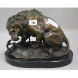 A bronze lion on base, signed height 24cm width 30cm