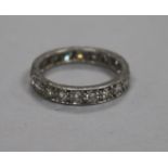 A platinum and diamond full eternity ring, set with twenty round cut diamonds and numbered 6122,