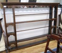 A mid 18th century oak plate rack W.163cm