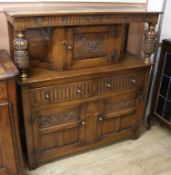 A 17th century style carved oak court cupboard W.127cm