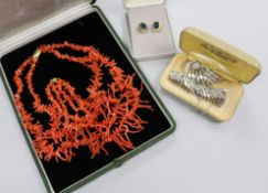 A coral necklace, a costume bracelet, brooch and pair of earrings.