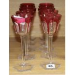 A set of ten cranberry overlay glasses height 19cm