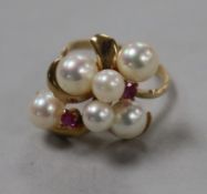 A 14k gold, cultured pearl and ruby cluster dress ring size J.