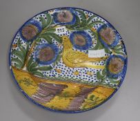 A Slipware polychrome pottery dish (Manises) signed AS (19th century) diameter 33cm