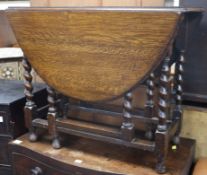 An oak gateleg table W.92cm