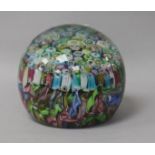 A Murano close-packed millefiori glass paperweight