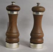 A pair of 1960's silver mounted turned wooden salt and pepper mills, 15.1cm.