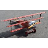 A model of a Fokker Dr1 fighter aircraft in the Red Baron's livery length 150cm width 186cm
