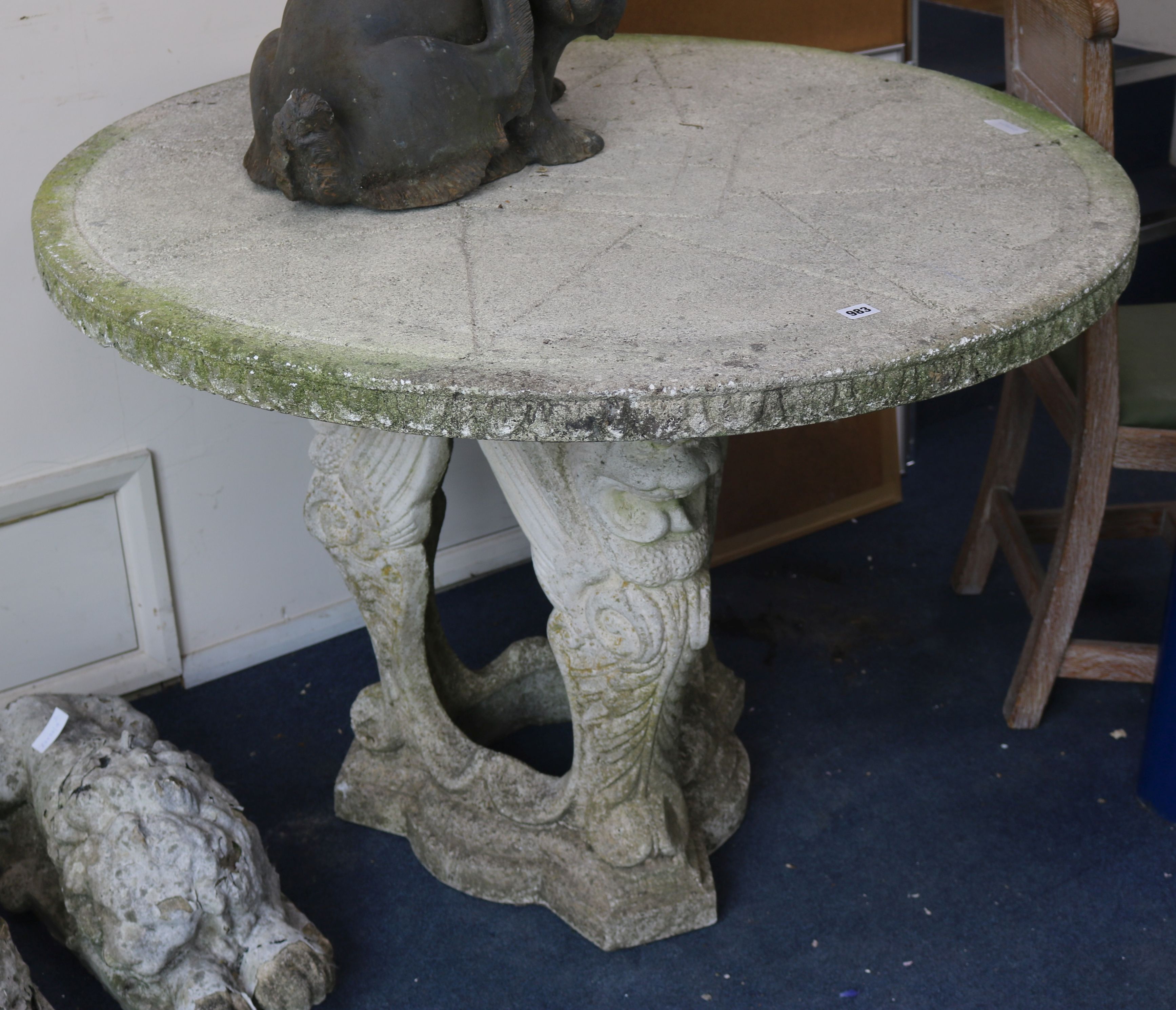 A reconstituted stone garden table W.111cm