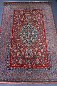 A Tabriz silk red medallion rug (moth damaged) 110 x 170cm