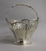 A George V pierced silver sugar basket (no liner), E.S. Barnsley & Co, Birmingham, 1915, 88cm.