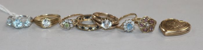 Seven assorted 9ct gold and gem set rings and a locket.