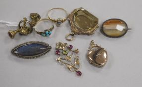 Two Victorian yellow metal and gem set rings, an Edwardian 9ct gold spinning fob, a 9ct gold pendant