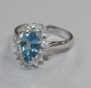 A modern 18ct white gold, aquamarine and diamond set pear shaped cluster ring, size M.