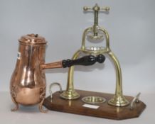 A brass lemon squeezer and a coffee pot squeezer height 36cm