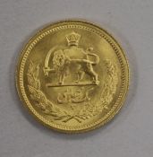 An Iranian One Pahlavi gold coin, Mohammad Reza Shah, 8.1g, AEF