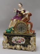 A Jacob Petit porcelain mantel clock, the circular Roman dial with silvered chapter ring, having