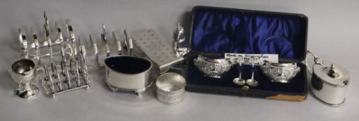 Assorted silver items including toastracks, box with hinged cover, napkin rings, condiments etc.