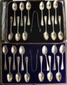 Two cased sets of twelve silver teaspoons with sugar tongs.