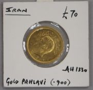 An Iranian One Pahlavi gold coin, Mohammad Reza Shah, in sealed mount 8.1g net, AEF