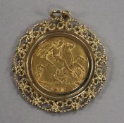 A George V gold half sovereign, 1911, in fancy openwork yellow metal pendant mount (unmarked), 7.