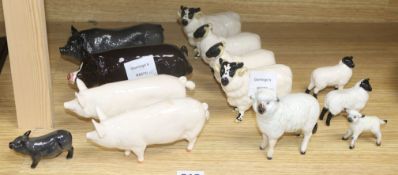 A collection of Beswick figures of sheep and pigs