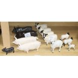 A collection of Beswick figures of sheep and pigs