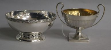 A George V demi fluted two handled pedestal sugar bowl, Mappin & Webb, London, 1913 and a later