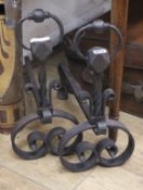 A pair of wrought iron fire dogs W.21cm