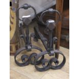 A pair of wrought iron fire dogs W.21cm