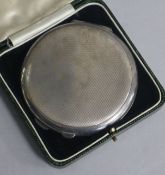 An engine turned silver circular compact by Mappin & Webb, Birmingham, 1961, 84mm.
