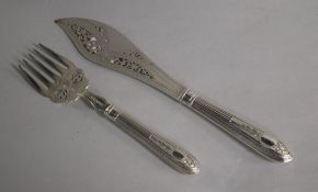 A pair of Victorian silver fish servers, Henry Harrison, Sheffield, 1870, knife 31cm.