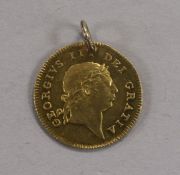 A George III gold half guinea, 1813, Obv. seventh laureate head, Rev. crowned shield of arms